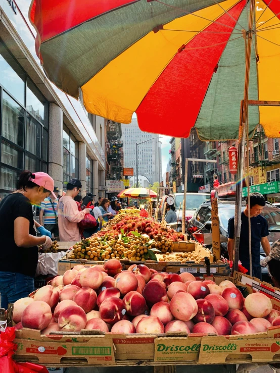 there are many fruit vendors on the street
