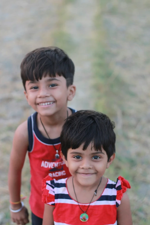 two young children standing near each other