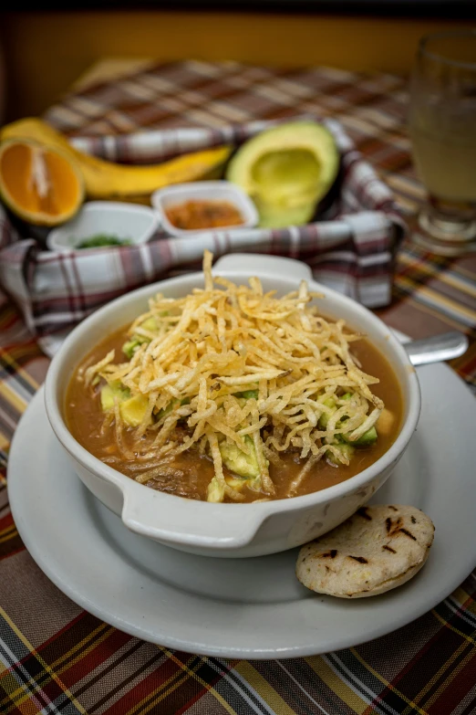 a bowl of soup and some ers on a table