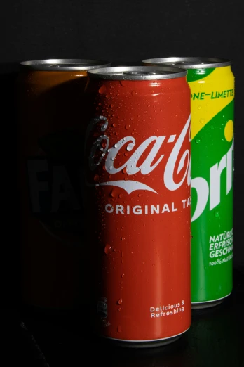 two cans of soda are shown in this close up po