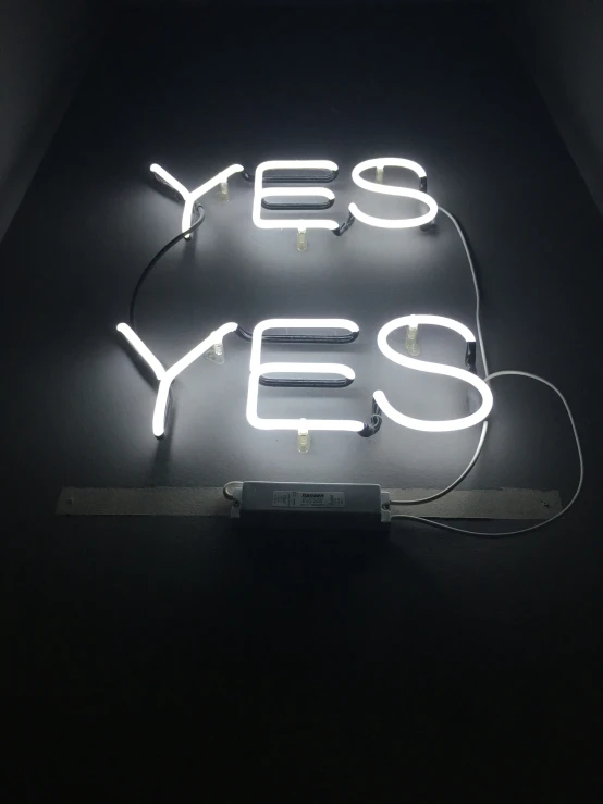 this sign has a light up yes yes sign underneath it