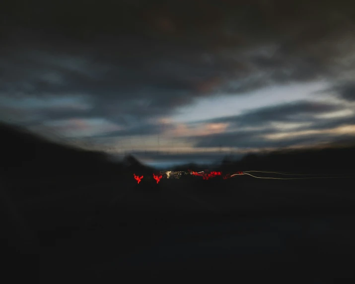 a blurred image with dark colors of some sort