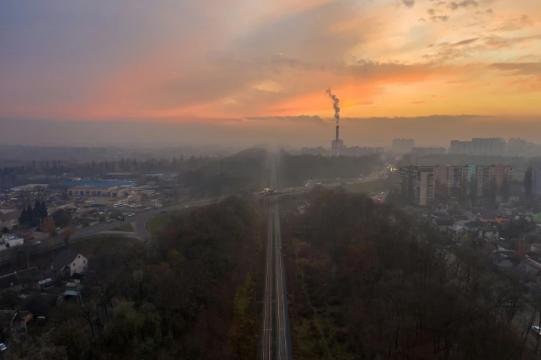 fog covers the skyline as sun is rising