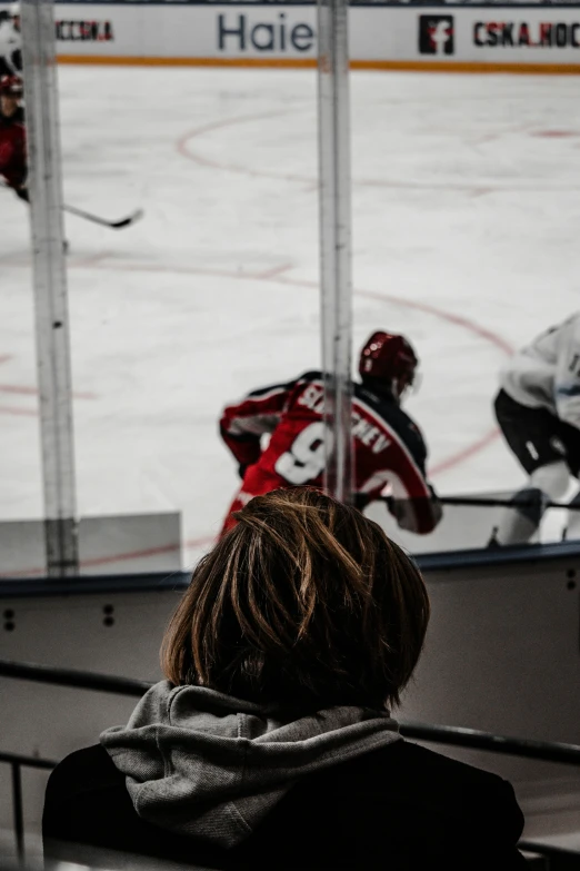 an image of a hockey game going on in the rink