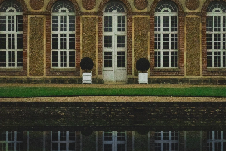 an image of a reflection of a house in the water