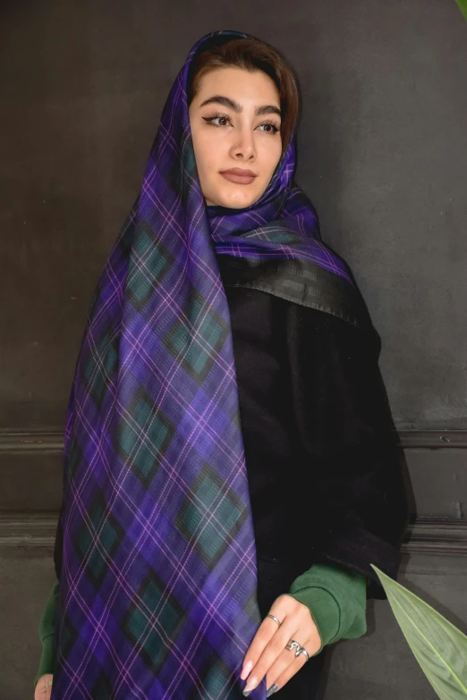 woman with dark hair and purple scarf