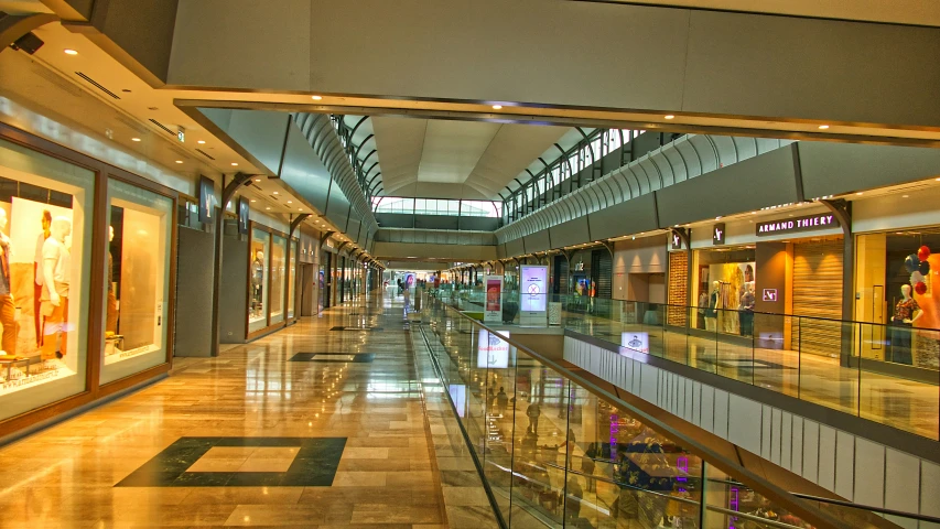 an empty shopping center with glass balconies