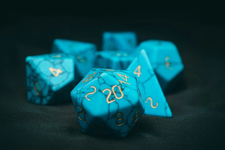 turquoise and gold chess dice set on black