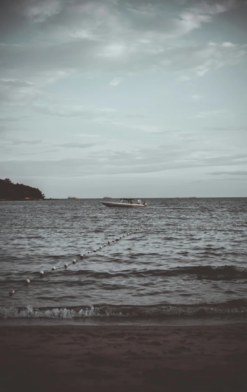 a boat floating on top of a large ocean