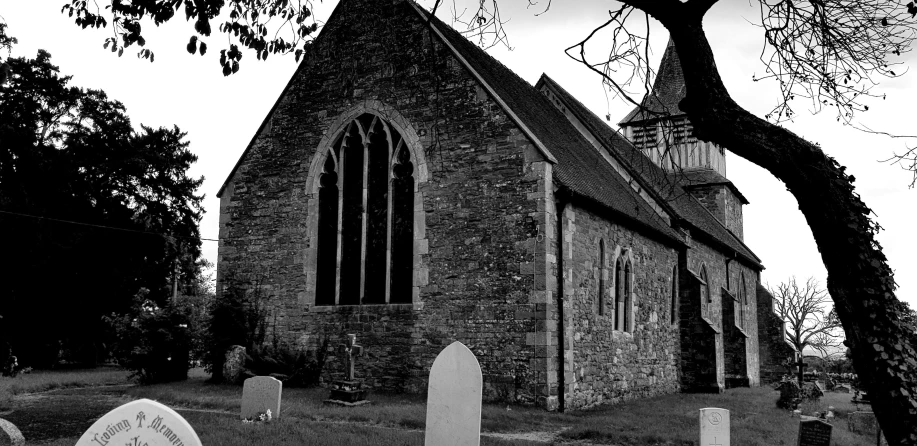 the front of a church with graveyard on either side