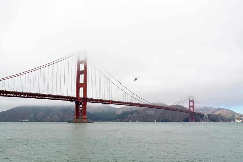 fog rising off the golden gate bridge from a boat