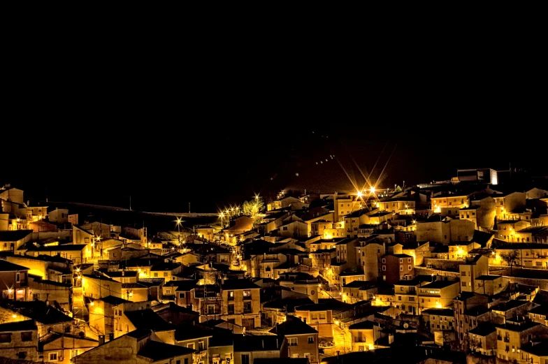 night time cityscape with buildings lit up in the foreground