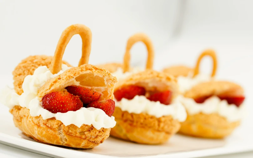 there are some strawberries on a pastry that is on a plate