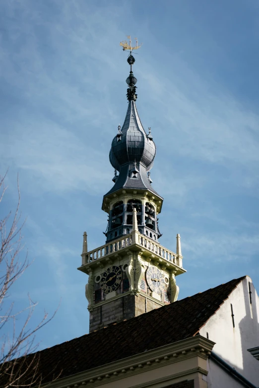 the top of a building has a tall clock