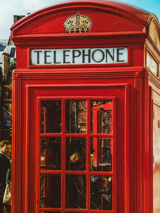 an old - fashioned phone booth that was recently used as a shop