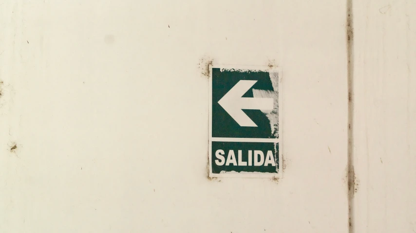 a white door with an arrow sign on it