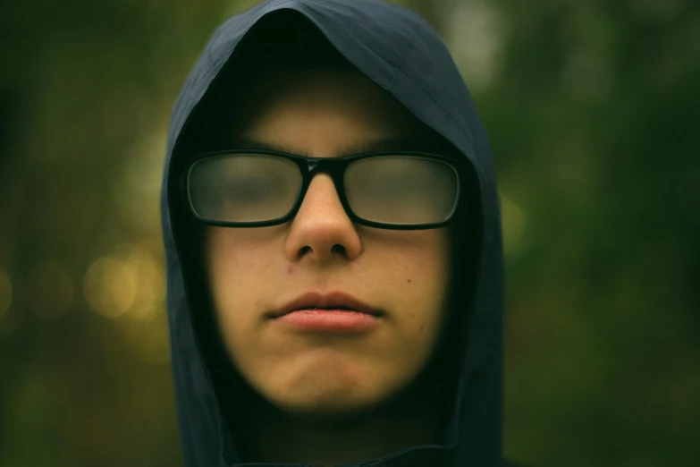 man in a hooded hoody looking off into the distance