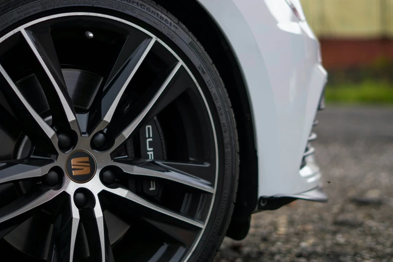 the tire on this white sports car is visible