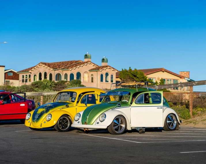 vintage cars parked next to each other in a parking lot