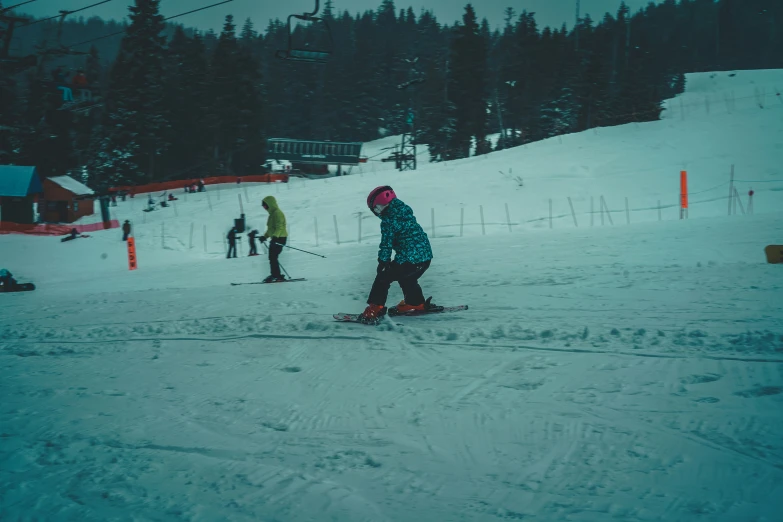 skiers with goggles are riding down the hill