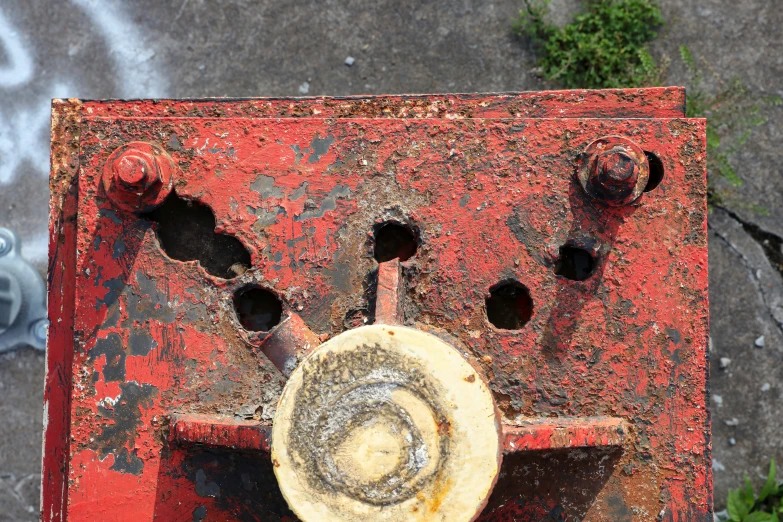 an old fire hydrant with holes in it