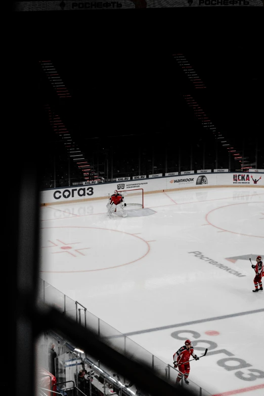 three hockey players on the ice during a game