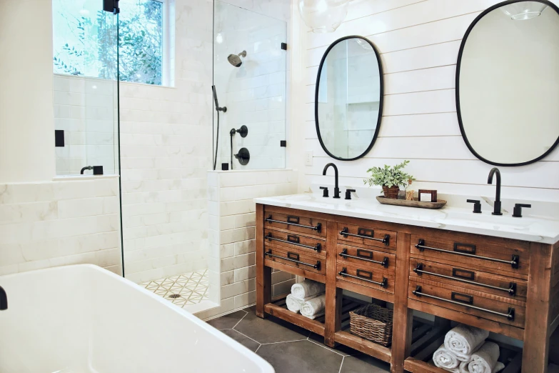 a nice white bathroom with an open shower stall