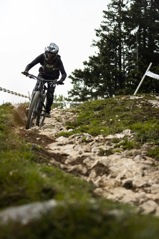 a mountain biker makes a turn on his bike