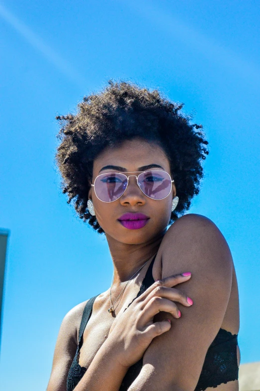 a black woman with pink lipstick on her face