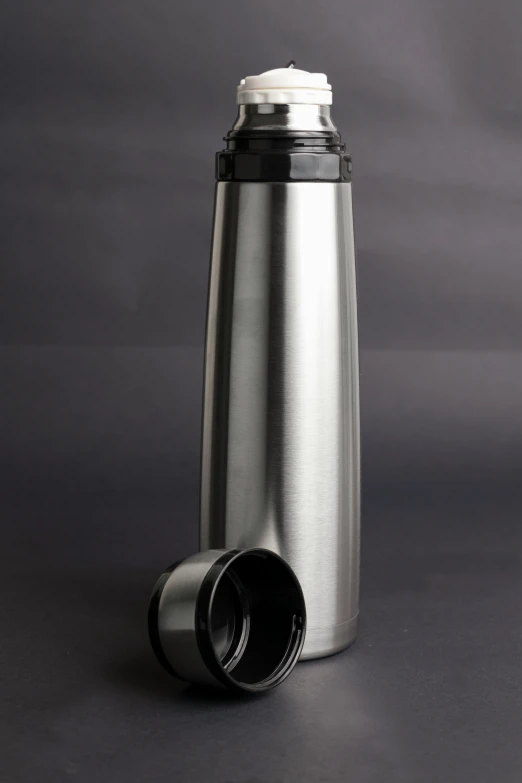a stainless steel travel tumbler with lid