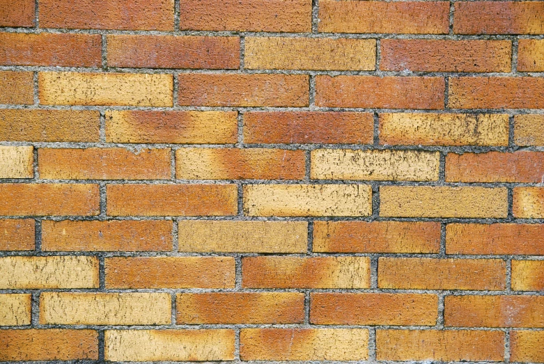 a closeup image of a red brick wall