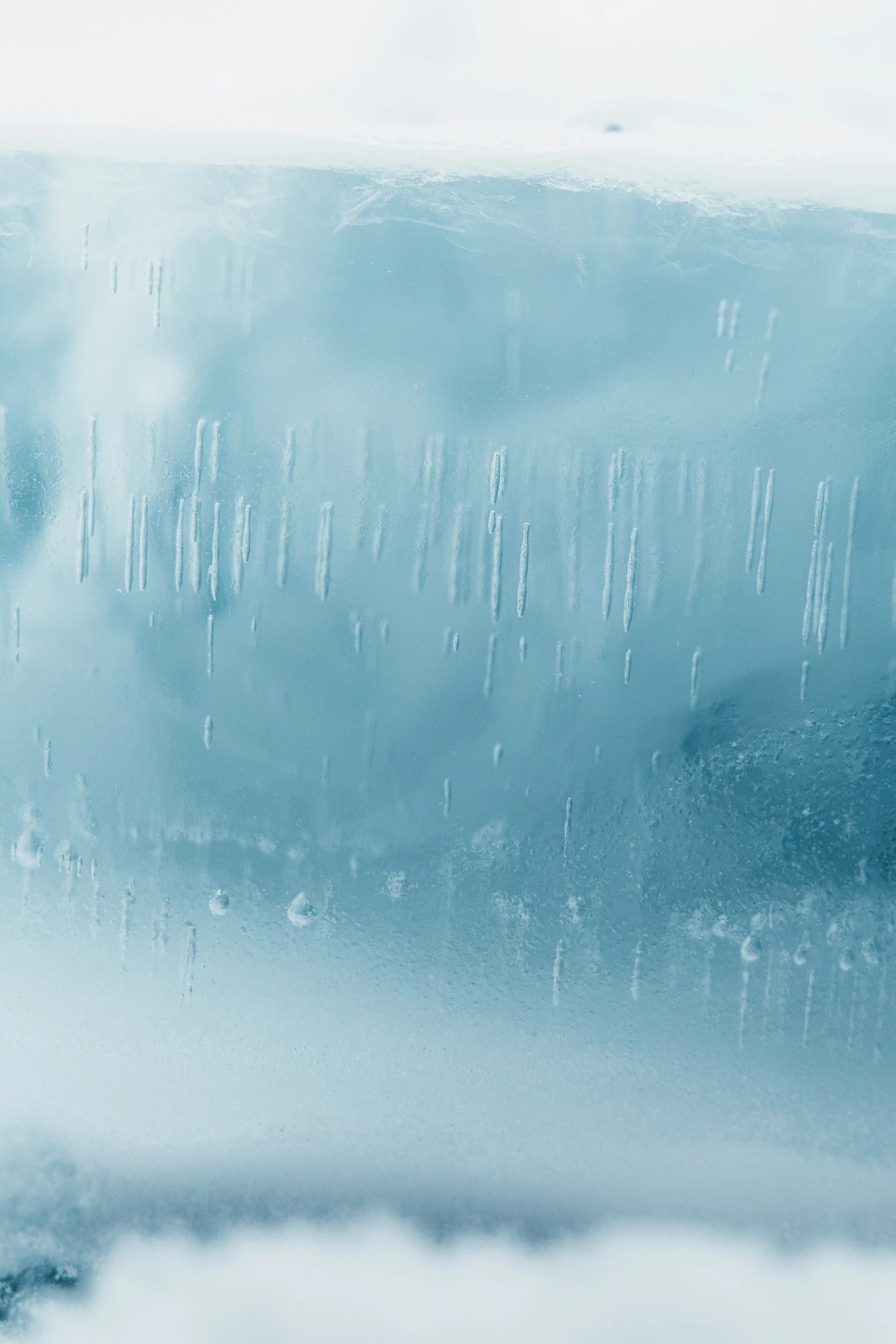 a white and blue background with water droplets