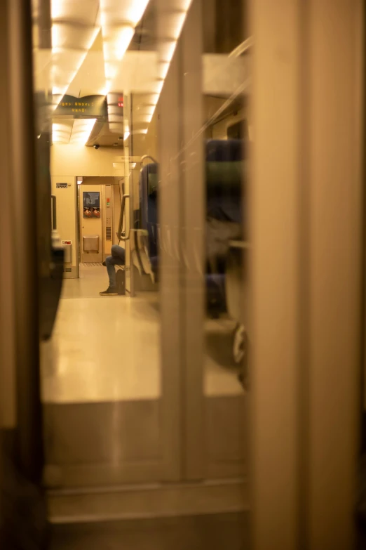 the large room has sliding glass doors that leads to an empty hallway