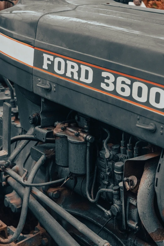 a close up of an old black tractor