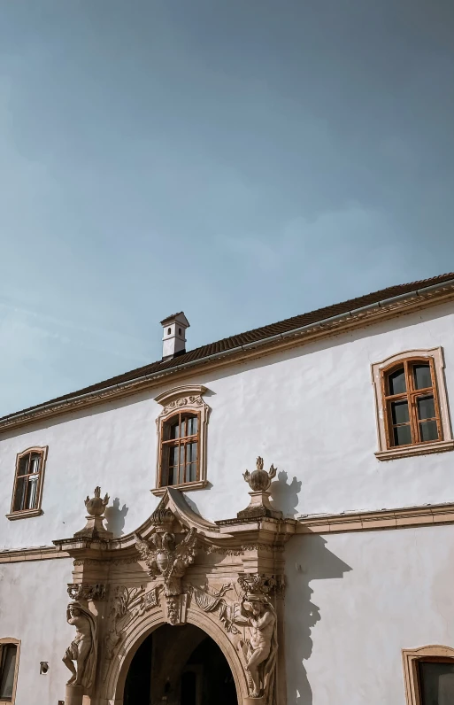 an old building with a door and windows