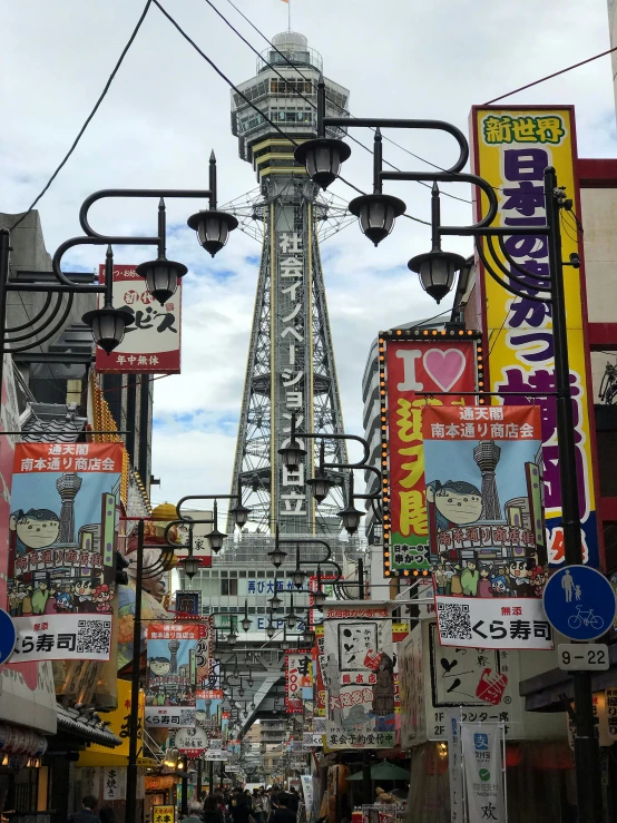 there are many signs on the buildings along this street