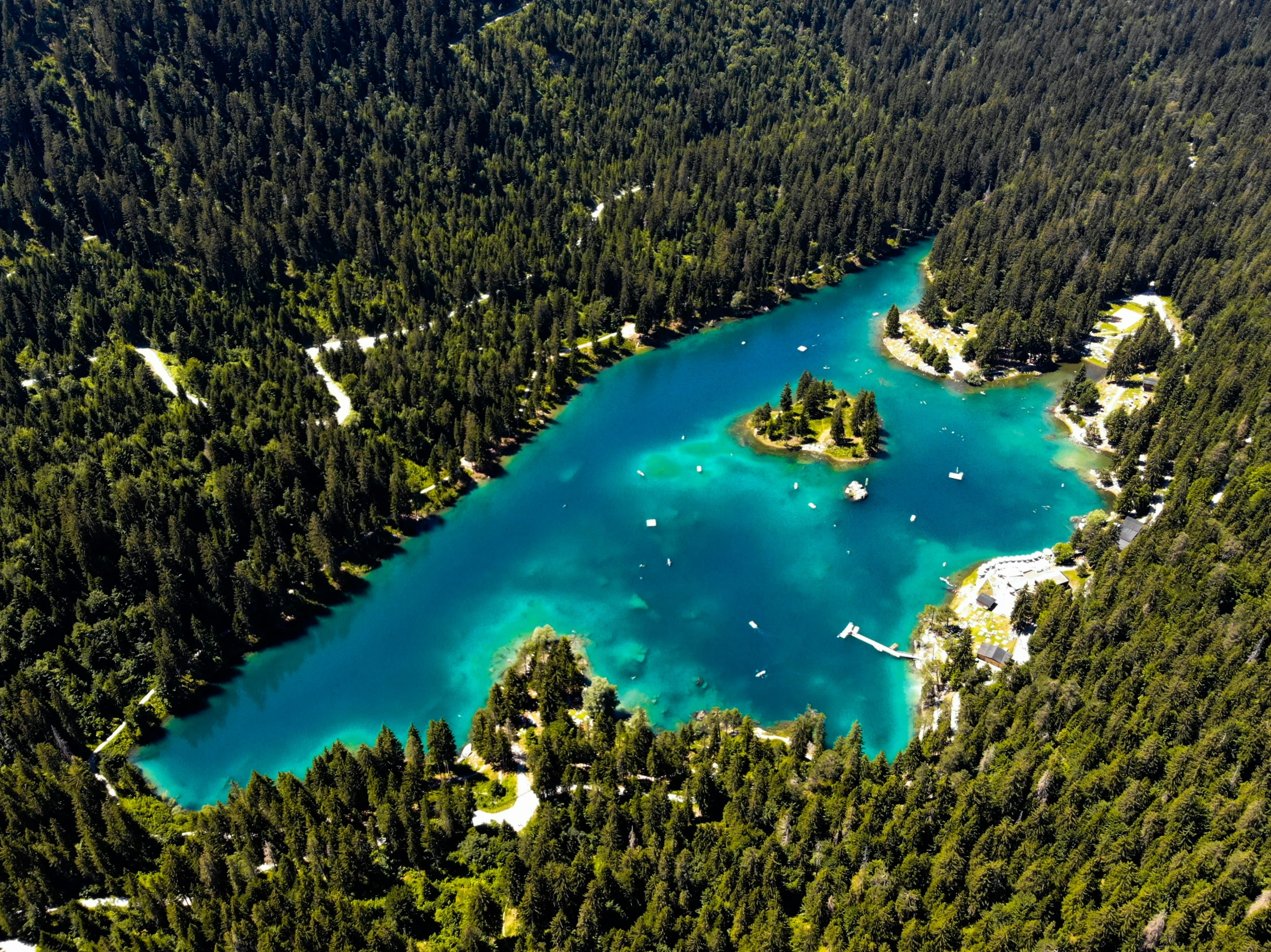 an island with two lakes surrounded by forest