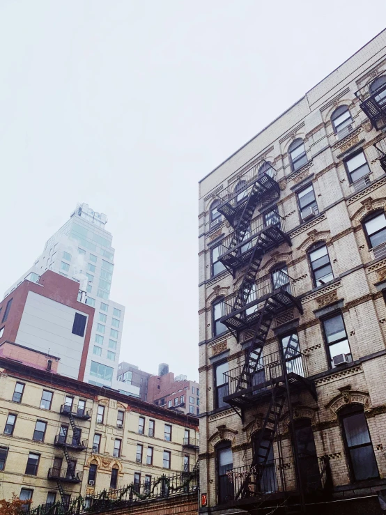 a tall building sitting next to another very tall building