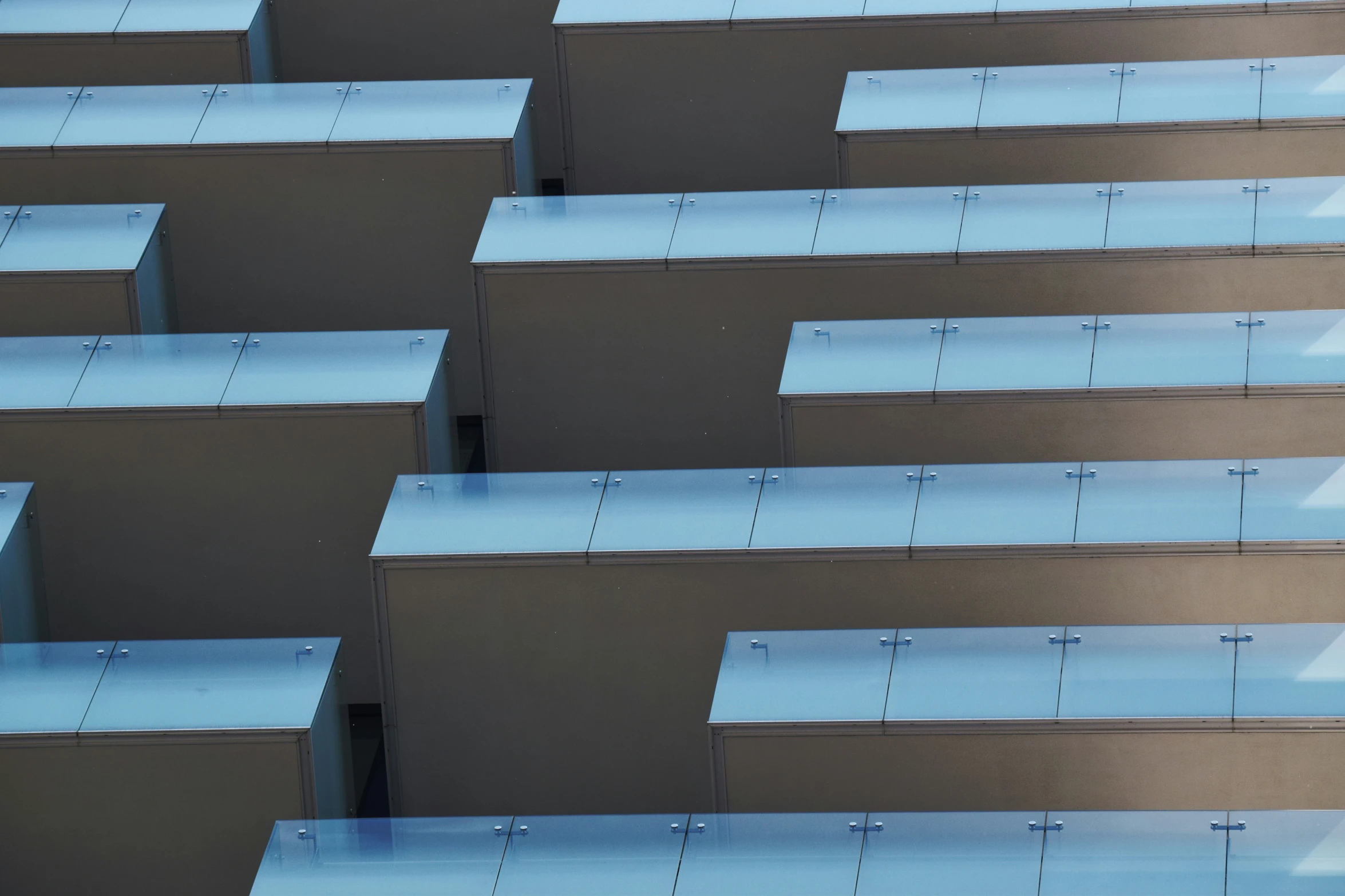 rows of desks lined up with different colors and shapes