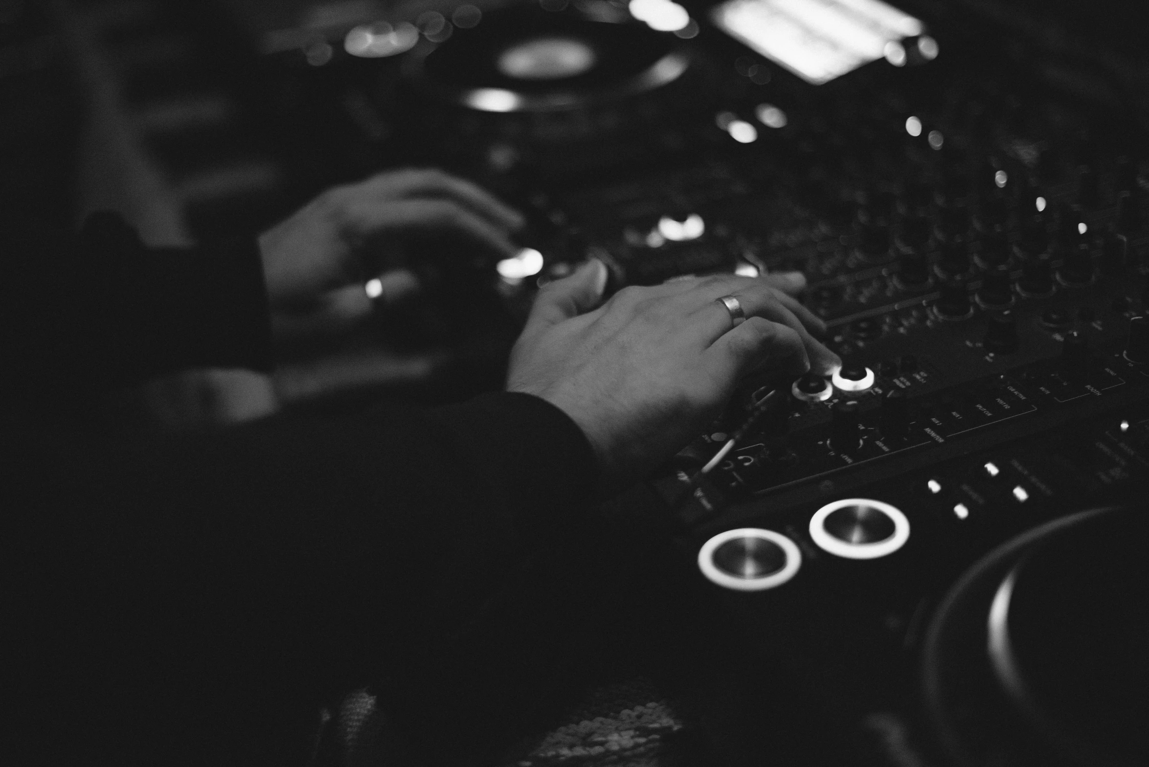 person working on music controls in a recording studio