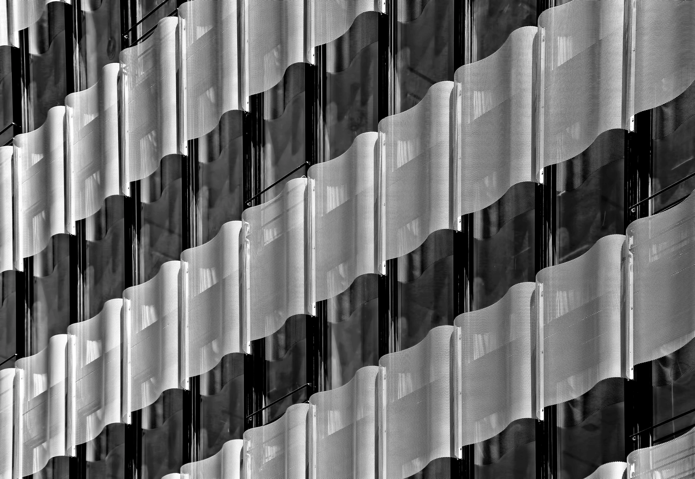 white and black architecture background with multiple vertical ridges in pattern