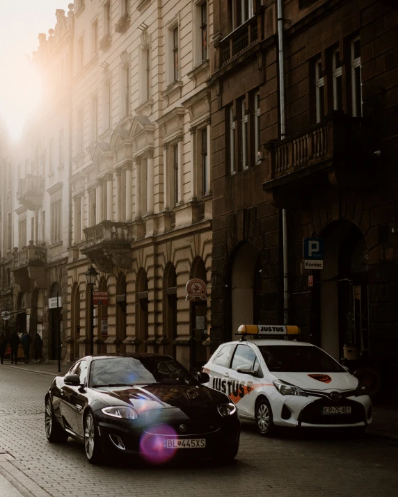 a street with cars parked on it and a building in the background