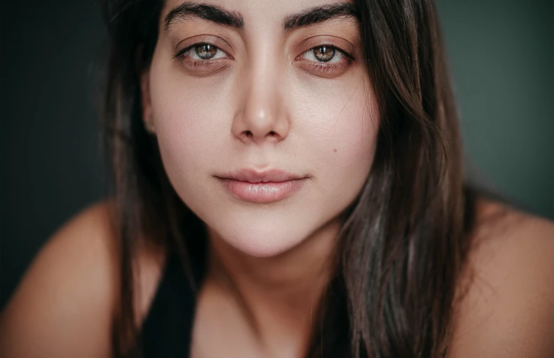 a girl poses for a po in black top