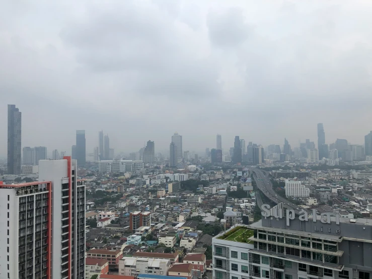 a city with tall buildings and sky in the background