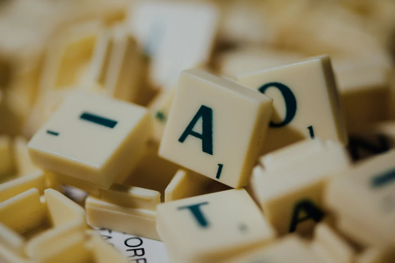 a close up of scrabble type letters with missing words