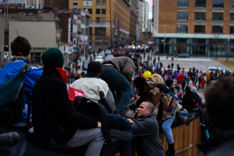 crowd gathered on side of building to watch event