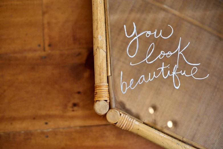 writing on an old mirror is displayed for the camera
