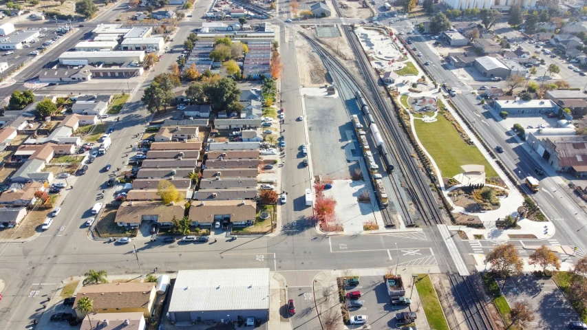 an aerial s of a rail road and neighborhood