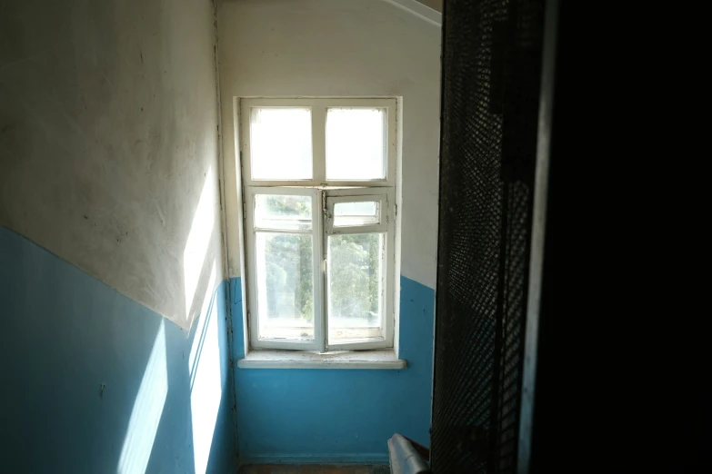 a blue room has some blue and white stripes on the walls