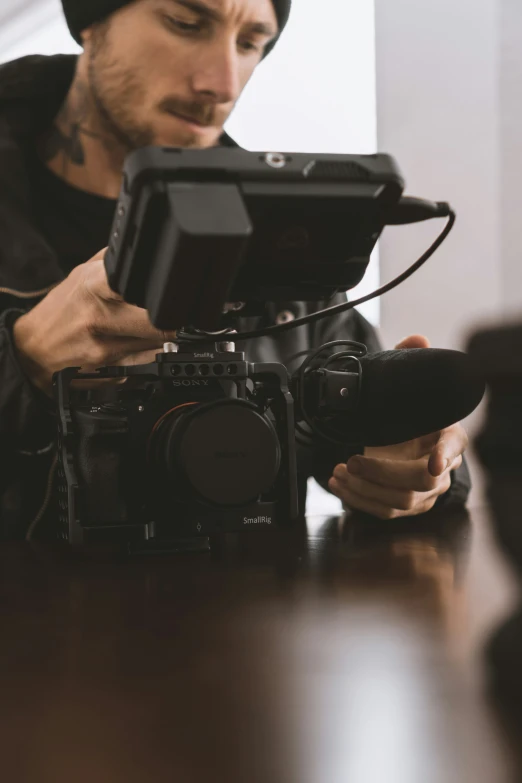 a man taking pictures on a small camera